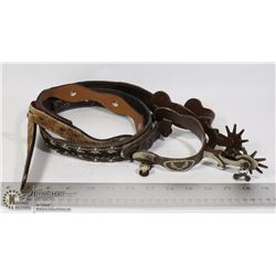 FLAT OF WESTERN GEAR SPURS WITH SILVER 2 BELTS