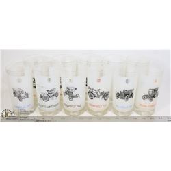 BUCKET OF GLASS CUPS WITH ANTIQUE CARS