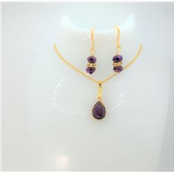 15)  GOLD TONE AND PURPLE SWAROVSKI