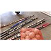 Image 2 : LOT OF LEFT HANDED HOCKEY STICKS AND SOFTBALLS