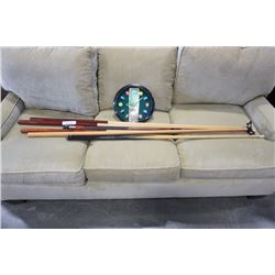 Lot of pool cues and billiards clock