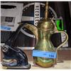 Image 1 : Office seal and a brass jug from Chilling Adventures(season 4)