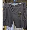 Image 2 : A rack of pants including dress pants and cargo pants