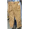 Image 7 : A rack of pants including dress pants and cargo pants