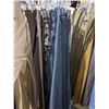 Image 2 : A rack of pants including jeans and cargo pants