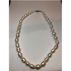 A Single Strand of Cultured Fresh Water Pearls with White Metal Clasp