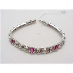 Lady's ruby and diamond bracelet; 7 blo