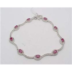 Lady's ruby and diamond bracelet; 9 ova