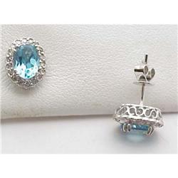 Blue topaz and diamond earrings; .83 ct