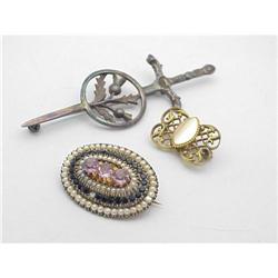Three vintage pins