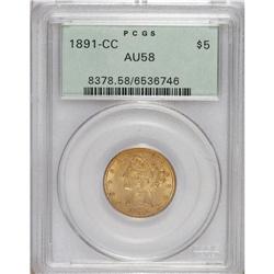 1891-CC $5 AU58 PCGS. An original dusky gold near-Mint
