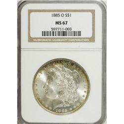 1885-O S$1 MS67 NGC. A sliver of cobalt-blue, lavender