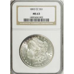 1892-CC S$1 MS63 NGC. A blush of plum-mauve toning gra