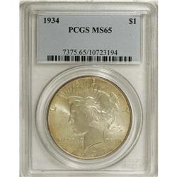 1934 S$1 MS65 PCGS. Green-gold and slate-gray intermin