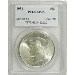 1934 S$1 MS65 PCGS. Gunmetal-blue and yellow-gold hues