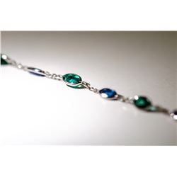 7) 14 KARAT WHITE GOLD SAPPHIRE AND EMERALD