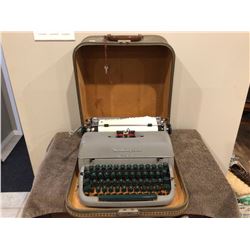 Vintage Remington Quiet-Rite portable typewriter with case and key