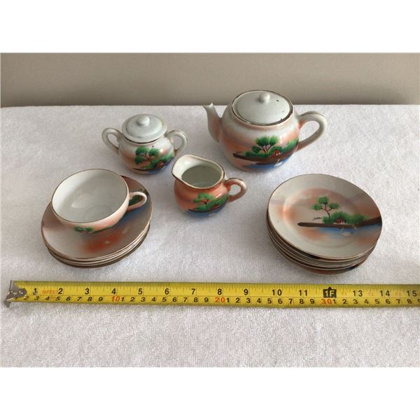 made in Japan mini tea set pieces, tea pot, cream and sugar, 1 cup, 5 saucers, 6 plates, some chips