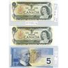 Image 1 : Two consecutive 1973 one dollar  bills, one 2002 five dollar bill printed in 2001