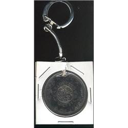 1964 $1 MS64 Superbly toned.  Mounted with chain and clasp.