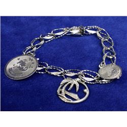 STERLING SILVER CHARM BRACELET WITH THREE CHARMS