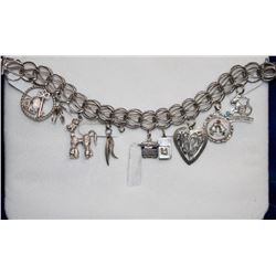 STERLING SILVER 7" CHARM BRACELET WITH 8 SILVER