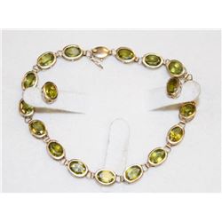 14K GOLD 7' BRACELET AND EARRINGS W 18 PERIDOT