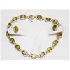 Image 1 : 14K GOLD 7' BRACELET AND EARRINGS W 18 PERIDOT