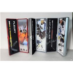 19)  LOT OF 3 NHL HOCKEY STICKS IN DISPLAY