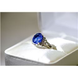 27) 10 KARAT WHITE GOLD TANZANITE AND DIAMOND RING