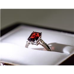 22) 10 KARAT WHITE GOLD GARNET AND DIAMOND RING