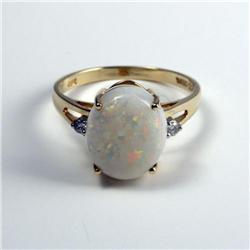 LADY'S 14K GOLD RING SET WITH OPAL AND DIAMONDS