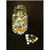 Image 2 : two quart glass canning jars filled with marbles. The first is a Ball jar filled with swirls, opaque