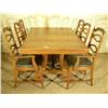 Image 2 : Dining room table and chairs having black upholstered chairs and wrought iron accented table base.