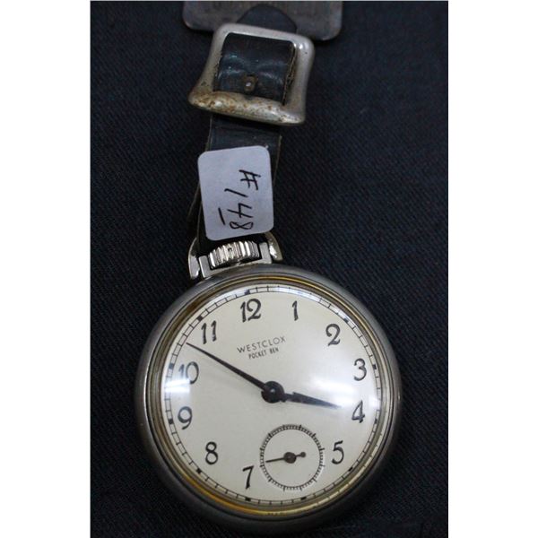 Westclox Pocket Ben Watch with a white face and a Caterpillar Fob