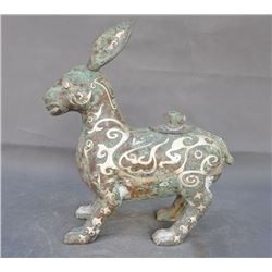 A BRONZE SILVER DONKEY STATUE MING DYNASTY.
