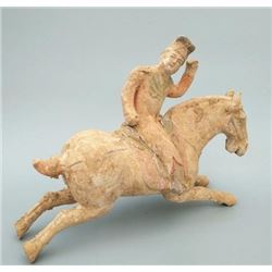 A PORCELAIN HORSE RIDER STATUE HAN DYNASTY 1ST/C.