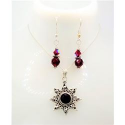27) LAB CREATED GARNET CARVED STAR PENDANT