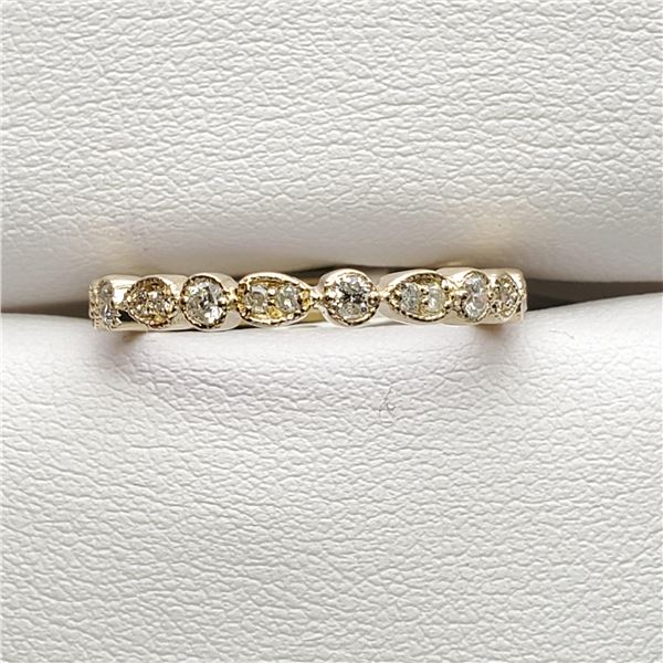 8) 10 KARAT YELLOW GOLD DIAMOND RING.