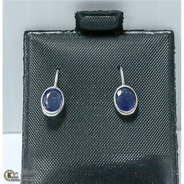 NEW. OVAL SAPPHIRE 4X6MM. SET IN SILVER. 0.7