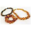 Image 1 : THREE AMBER COLORED BEADED NECKLACES