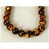 Image 5 : THREE AMBER COLORED BEADED NECKLACES