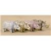 Image 1 : FOUR HAND-PAINTED PORCELAIN RHINOCEROSES
