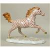 Image 1 : A HAND-PAINTED ORANGE-DECORATED PORCELAIN HORSE