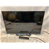 Image 1 : Vizo tv and remote