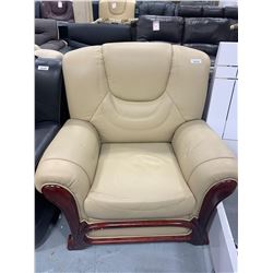 Wood Trimmed Ivory Leather Sofa chair ( small tear on back)