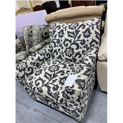 Upholstered black  white floral print sofa chair