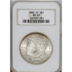 1880-CC S$1 MS65 NGC. Golden-brown and navy-blue grace