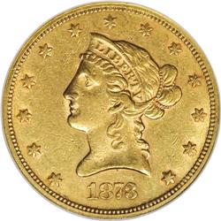 1873-S $10 AU55 NGC. Honey-gold surfaces reveal luster