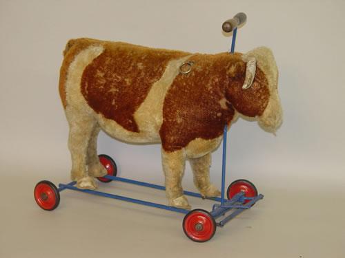 steiff cow on wheels